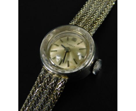 A Tissot ladies wristwatch, with small circular watch head, silvered dial, with four row bracelet, white metal, marked 750, 2