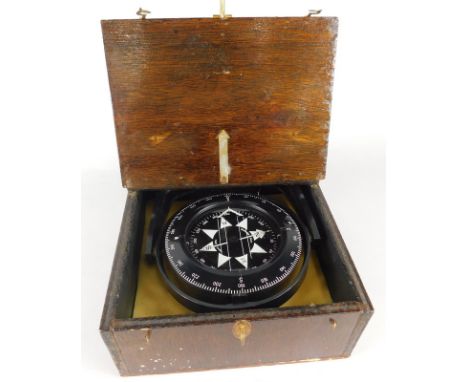 A ship's compass, made by Heath of London, titled 'The Sou'wester', in plastic and outer travelling case, 24cm wide