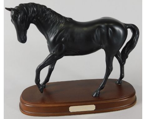 A Royal Doulton matt glazed ceramic figure, Spirit of Youth, on mahogany base, the base 24cm wide