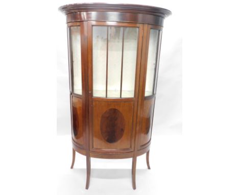 An Edwardian mahogany and ebony strung bow fronted display cabinet, with single part glazed door, on splayed legs, 106cm wide