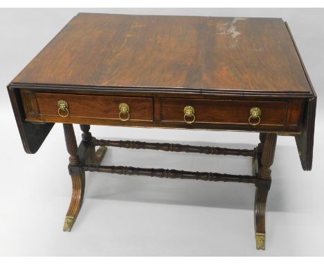 An early 19thC rosewood sofa table, the rectangular top with a reeded edge, above two frieze drawers opposing two false drawe