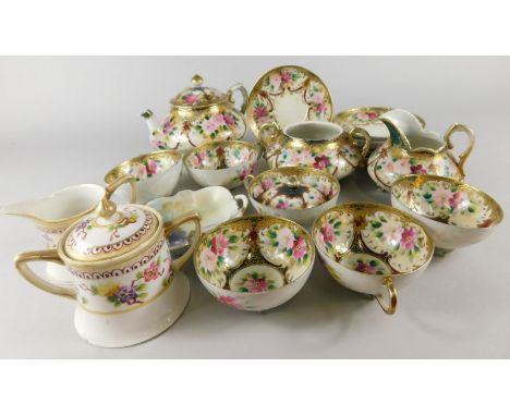 A Japanese Noritake style egg shell porcelain part tea service, decorated with flowers in the European style, a Noritake type