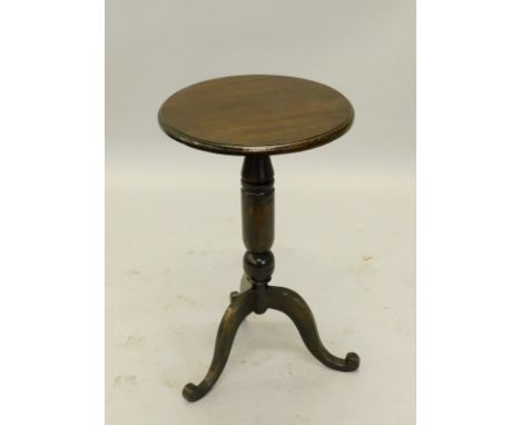 An ebonised occasional table, the circular top with a moulded edge, on a turned column, tripod base, 39cm diameter