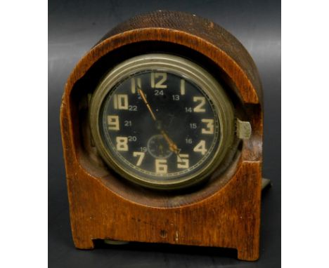 A Third Reich Heereseigentum or field clock, stamped to the inner section Kienzle number 1370 and dated 1940 in oak travellin