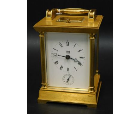 A Dent of London brass carriage clock, with repeat and alarm function, the gilt brass case glazed to three sides, with a hing