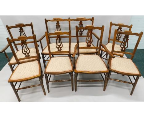 An early 20thC parlour type suite, comprising two seat chair back sofa, two armchairs and four matching side chairs, each wit