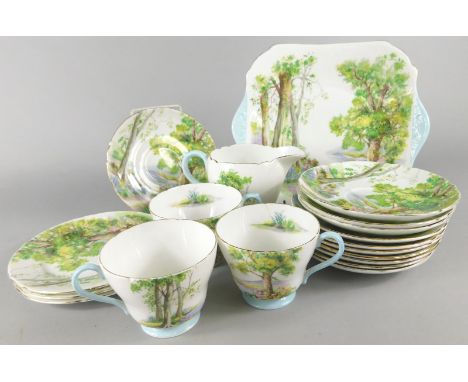 A Shelley Woodland part bone china tea service, number 13348, comprising sandwich plate, 24cm wide, milk jug, three cups, pla