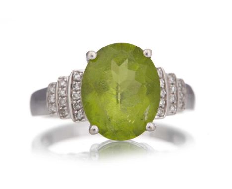 PERIDOT AND DIAMOND RING, set with an oval peridot on diamond shoulders, marked 14K, size MQty: 3.6g