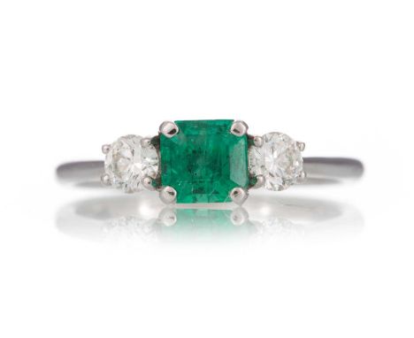 EMERALD AND DIAMOND RING,  set with an emerald of approximately 0.66 carats, flanked by diamonds totalling approximately 0.37