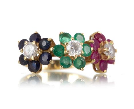 TRIPLE DAISY CLUSTER RING, formed by ruby and sapphire clusters, with a central green gem set cluster, each set with a centra