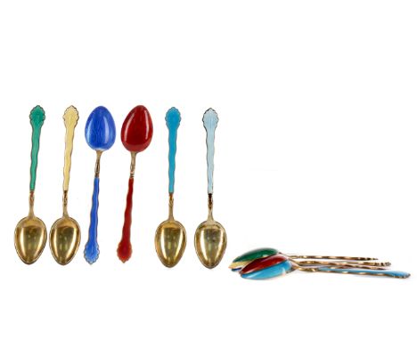 SET OF TWELVE SILVER GILT AND ENAMEL COFFEE SPOONS, impressed '925', with each with guilloche enamel handle in one of seven c