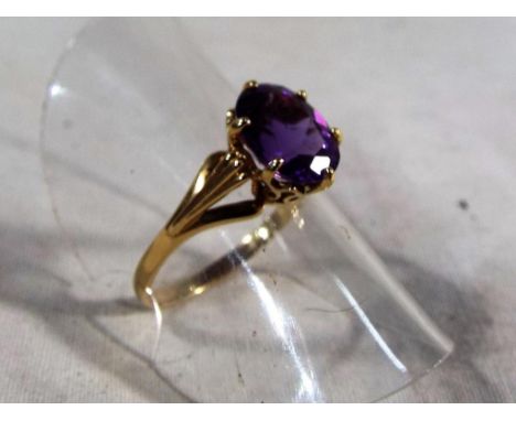 A hallmarked lady's 9ct gold and amethyst solitaire ring, approx 1.9 grams, size N, boxed