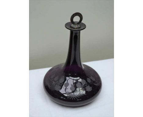 A 19TH CENTURY ETCHED AMETHYST GLASS DECANTER decorated with a floral swag and thistle heads, having a silver plate mounted c