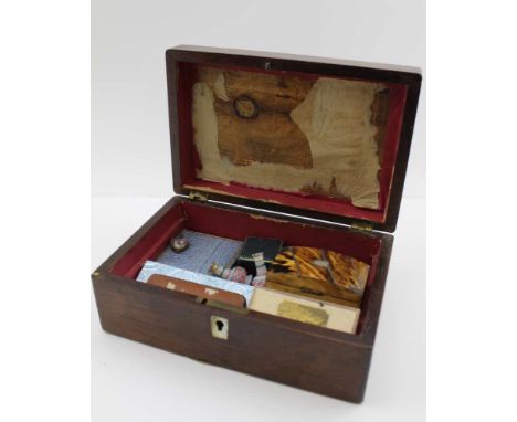 A ROSEWOOD BOX CONTAINING VARIOUS ITEMS, to include; a cased silver thimble, a Victorian portrait photograph in a leather cas