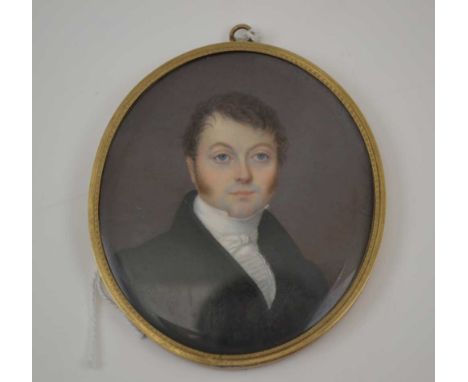A 19TH CENTURY MINIATURE PORTRAIT PAINTING OF A REGENCY GENTLEMAN, head and shoulders wearing a black jacket with white crava