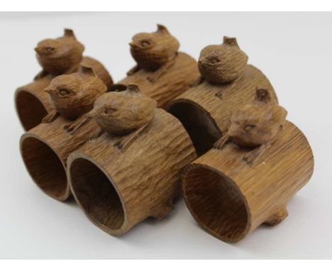  BOB "WREN MAN" HUNTER OF THIRLBY, THIRSK A SET OF SIX CARVED TIMBER NAPKIN RINGS, of hollow tree trunk form, each with a sig