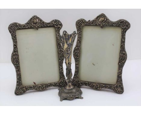 A PAIR OF SILVER MOUNTED EASEL PHOTOGRAPH FRAMES with ornate repousse decoration, one bearing Birmingham assay (indistinct da