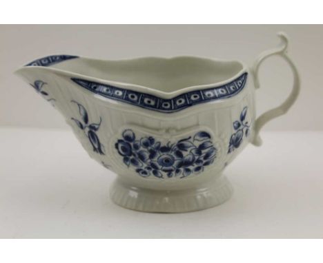 A DR WALL "FIRST PERIOD" WORCESTER PORCELAIN GRAVY BOAT, strap flute floral design, blue on a rococo moulded form, c.1770, un