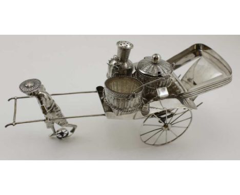 A CHINESE SILVER RICKSHAW CONDIMENT SET, with rolling wheels, comprising; a removable basket form pepper pot, salt and mustar