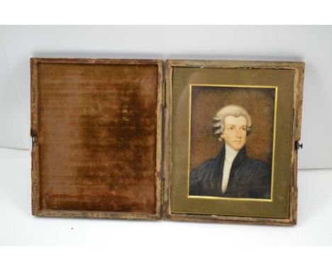 A 19TH CENTURY MINIATURE PORTRAIT PAINTING OF A YOUNG BARRISTER, head and shoulders in a wig and gown, 10cm x 7.5cm, mounted 