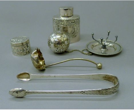 A small quantity of silver and silver plate including a small silver tea caddy and a Continental silver pill box. The former 