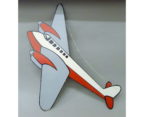 A painted wooden wall hanging formed as a vintage aeroplane. 100 cm long.