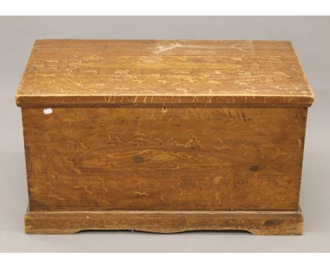 A Victorian pine trunk with original scumble finish. 88 cm wide x 49 cm high.