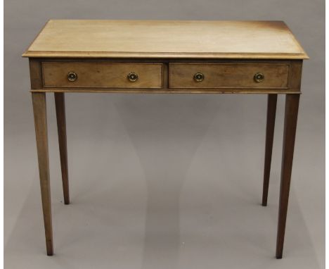 A mahogany two-drawer side table. 101 cm wide, 87 cm high, 40.5 cm deep.