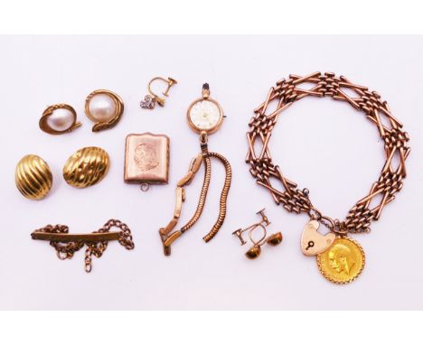 A quantity of various scrap gold jewellery, to include a 9 ct gold gate bracelet with 1911 half sovereign 20.9 grammes, a 9 c