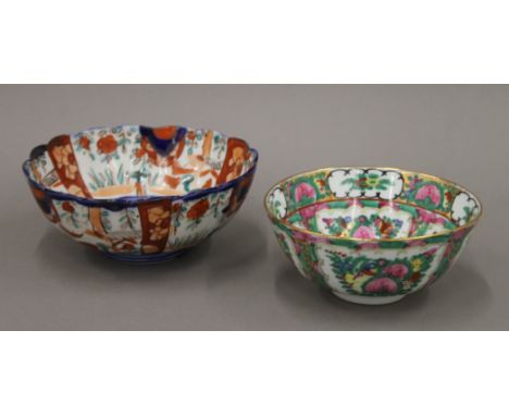 An Imari porcelain bowl and a Chinese famille rose porcelain bowl. The latter 15.5 cm diameter.