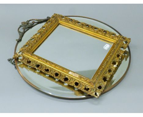 A gilt-framed mirror and an early 20th century circular mirror. The latter 46 cm diameter.