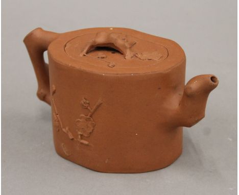 A Chinese Yixing teapot. 19 cm long.
