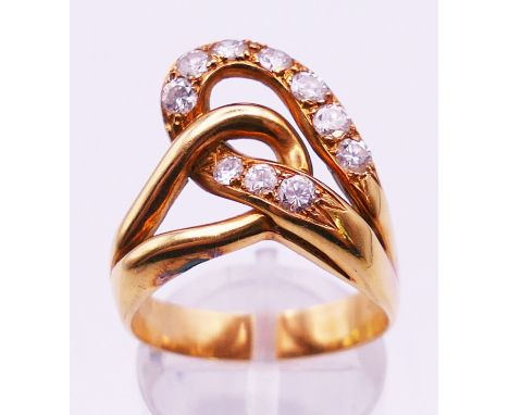 An unmarked gold and diamond ring. Ring size Q/R. 6.5 grammes total weight.  Note: for matching earrings see Lot 14.