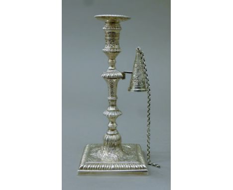 A Georgian engraved silver taper stick and snuffer. 15.5 cm high. 7.6 troy ounces.