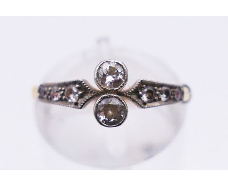 An 18 ct gold and diamond ring. Ring size K/L. 2.2 grammes total weight.