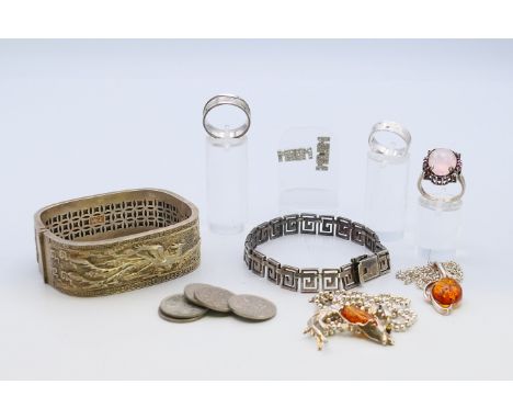 A Chinese bracelet and a quantity of silver jewellery to include rings, a Greek key pattern bracelet, two 'amber' pendant nec
