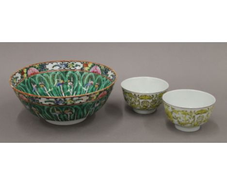 A pair of Chinese Republic porcelain bowls painted with bats and flowers together with a Canton bowl painted with leaves and 