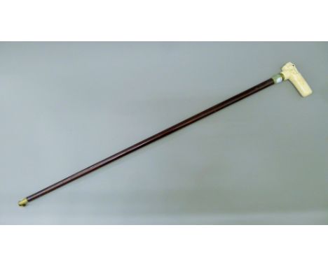 A bone-topped rabbit walking stick. 89 cm long.