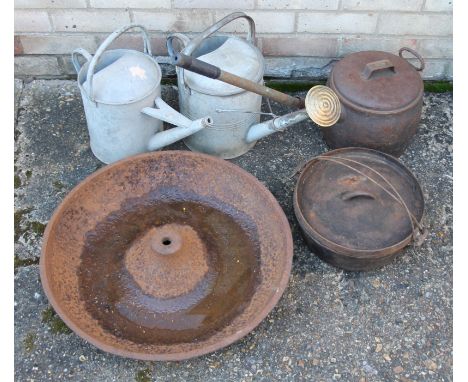 A cast iron trough, two watering cans and two cooking pots. The former 57 cm diameter. 