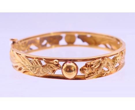 A Chinese 22 K gold bangle bracelet.  5.5 cm diameter, 8 mm high. 17.1 grammes.