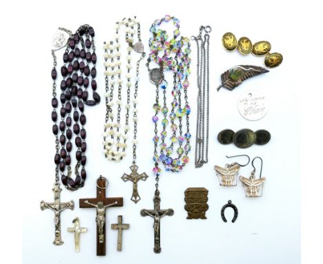 Three rosary beads, a crucifix pendant, two crosses, a silver and abalone shell Kiwi bird and fern brooch, a Dutch three coin
