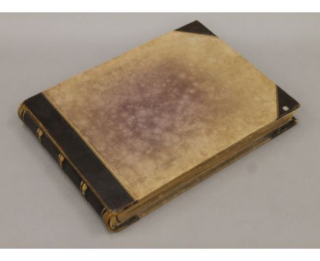 A photograph album including photographs of E M Forster and Forster family members (including possibly Emily Nash) some dated