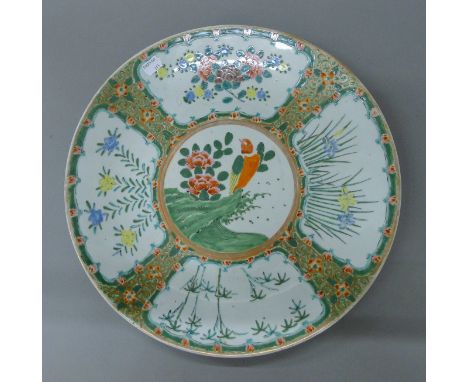 A 19th century Chinese charger decorated with a bird. 40 cm diameter.