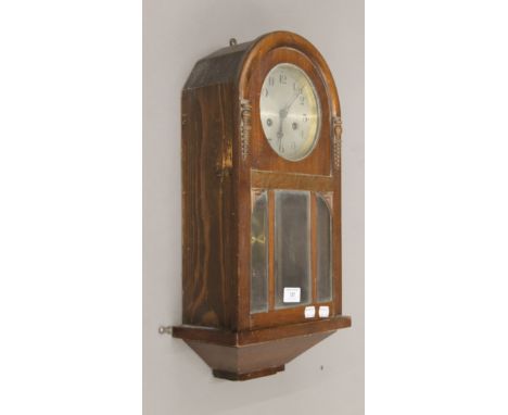 An early 20th century wall clock. 52 cm high.