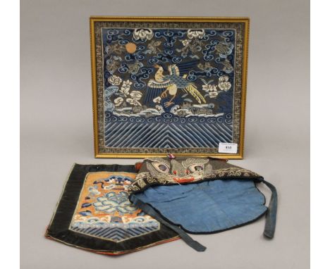 A Chinese rank badge embroidered with a phoenix amongst clouds (framed and glazed), a Chinese silk embroidered child's hat an