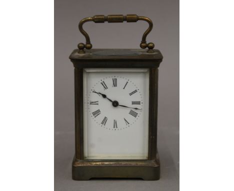 A brass-cased carriage clock. 13.5 cm high.