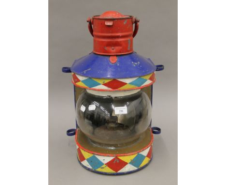 A 19th century bargeware lamp. 50 cm high.