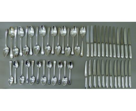 A quantity of English and Irish bright-cut silver flatware of various dates and makers. The largest spoon 23 cm long. 91.5 tr