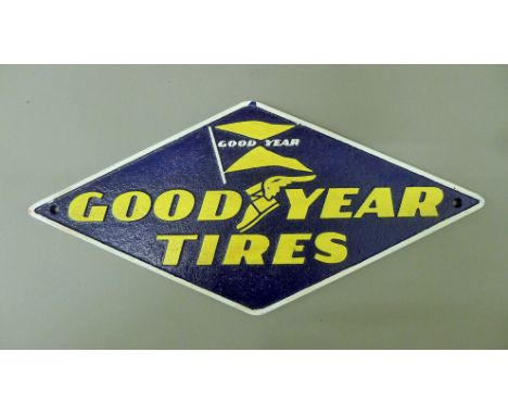 An iron 'Goodyear' sign. 40 cm wide.