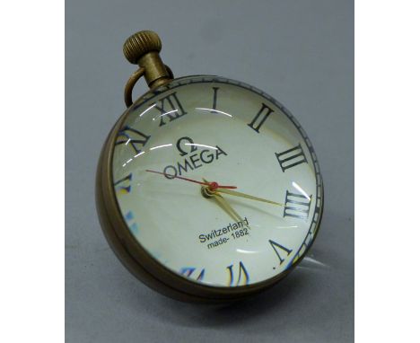 A ball clock. 7.5 cm high.